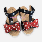 Sandalias Baby Lu negras con lunares blancos y lazo rojo brillante de Minnie Mouse para niña
